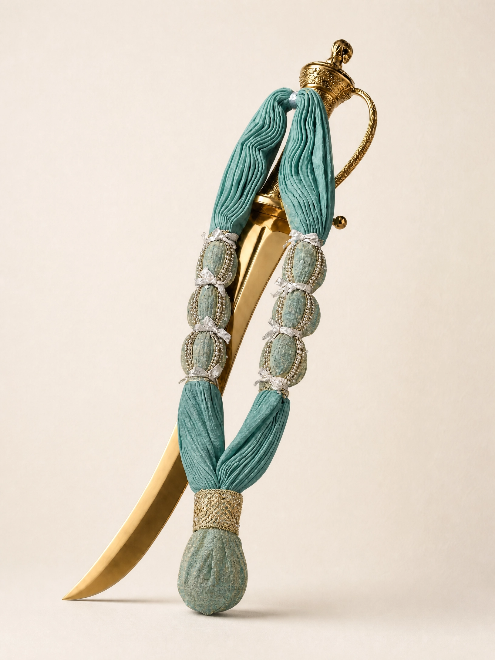 Maha Raj Maala in jade teal, on a gilt talwar